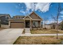 Charming single-Gathering home with a well-kept lawn, covered porch and a two-car garage at 5495 Espana Ct, Denver, CO 80249