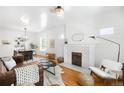 Inviting living room with fireplace, hardwood floors, and ample natural light, creating a cozy atmosphere at 4363 N Raleigh St, Denver, CO 80212