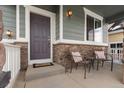 Inviting front porch with two chairs and a welcome mat at 40 Ferris Ln, Erie, CO 80516