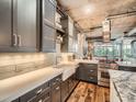 Bright kitchen with stainless steel appliances, modern cabinets and white subway tile backsplash at 1401 Wewatta St # 308, Denver, CO 80202
