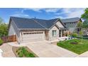 Inviting single-Gathering home features a two-car garage, manicured lawn, and charming front porch in a desirable neighborhood at 14833 Vine St, Thornton, CO 80602