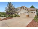 Beautiful exterior of a home featuring a two-car garage and well-manicured landscaping at 22019 E Arbor Dr, Aurora, CO 80016