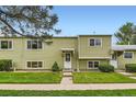 Well-kept townhouse with a green lawn, neat landscaping, and a welcoming entrance at 5721 W 92Nd Ave # 96, Westminster, CO 80031