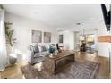 Spacious living room featuring hardwood floors, neutral colors, and ample natural light at 3088 S Grape Way, Denver, CO 80222