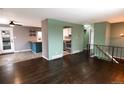 Open-concept kitchen featuring stainless steel appliances and an eat-in breakfast bar at 5063 W 61St Ave, Arvada, CO 80003