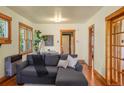 Cozy living area with a comfortable sectional sofa, hardwood floors, and natural light at 652 N Gilpin St, Denver, CO 80218