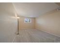 Cozy bedroom featuring neutral carpet and a large window providing natural light at 16259 W 10Th Ave # J1, Golden, CO 80401