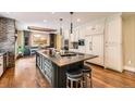 Gourmet kitchen with large center island, stainless appliances, and custom cabinets, ideal for entertaining at 14118 Whitney Cir, Broomfield, CO 80023