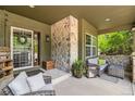 Inviting covered front porch with stone accents and comfortable seating area at 14118 Whitney Cir, Broomfield, CO 80023