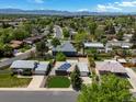 Sprawling community with tree-lined streets, mountain views, and solar panels at 8641 Rutgers St, Westminster, CO 80031