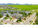 An aerial view of a neighborhood with solar panels on many of the homes at 9567 Juniper Way, Arvada, CO 80007