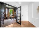 Home office featuring French doors, a large window, and a comfortable desk area at 9567 Juniper Way, Arvada, CO 80007