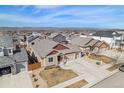 A high angle aerial shot of a lovely home and surrounding community, showcasing mountain views at 6817 Sequoia St, Frederick, CO 80530