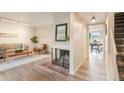 Cozy living room with fireplace and modern lighting, creating a warm atmosphere at 404 Raspberry Ln, Monument, CO 80132