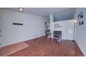 Bright living room with hardwood floors and a view of the fireplace at 4443 E Bennington Ave, Castle Rock, CO 80104