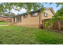 Charming brick home with well-maintained front yard and privacy fence at 6627 Eaton St, Arvada, CO 80003