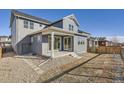 Exterior view of a well-maintained home, featuring a covered back patio at 2670 E 102Nd Pl, Thornton, CO 80229