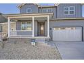 Welcoming two-story home featuring a cozy front porch and attached garage at 2670 E 102Nd Pl, Thornton, CO 80229