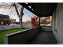 View from a charming front porch with a covered area and well manicured lawn at 374 S Lincoln St, Denver, CO 80209