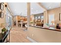 Open-concept living space with hardwood floors seamlessly connects the kitchen at 2429 S Orchard St, Lakewood, CO 80228