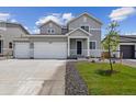 Beautiful two-story home with a two-car garage, complemented by a green lawn and modern design at 14400 Heritage Dr, Mead, CO 80504
