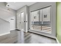 Bright and airy entryway with hardwood floors and frosted glass door at 1927 Eaton St, Lakewood, CO 80214