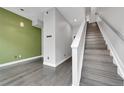 Modern staircase with dark wood treads and white risers at 1927 Eaton St, Lakewood, CO 80214