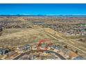 Aerial view of home on a cul-de-sac with mountain views, nestled in a Gathering-friendly suburban community at 16333 Prairie Farm Cir, Parker, CO 80134