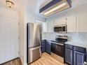 Updated kitchen with stainless steel appliances and marble countertops at 11167 W 17Th Ave # 104, Lakewood, CO 80215