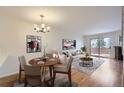 Bright living room with hardwood floors and a view to the backyard at 11167 W 17Th Ave # 104, Lakewood, CO 80215