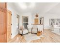 Bright living room with hardwood floors, comfortable seating, and neutral decor at 102 Jackson Cir, Louisville, CO 80027