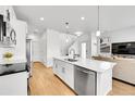 Beautiful kitchen with an island, stainless steel appliances, and modern finishes at 4027 E 98Th Pl, Thornton, CO 80229