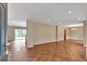 Spacious living room features sleek wood-look tile floors and an open layout at 1038 Tenderfoot Dr, Larkspur, CO 80118