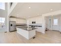 Modern kitchen with stainless steel appliances, large island, and plenty of cabinet space at 907 Congress Pl, Elizabeth, CO 80107