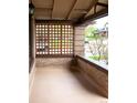 Inviting front porch with brick features and wood lattice, perfect for relaxing at 401 S Williams St, Denver, CO 80209