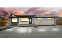 Charming single-story home with unique rock accent and covered front porch at sunset at 9300 Grove St, Westminster, CO 80031