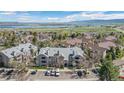 Aerial view of the community with mountain and lake views in the background at 8378 S Upham Way # B305, Littleton, CO 80128