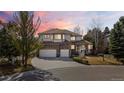 Beautiful two-story home with a three-car garage, brick accents, and a landscaped front yard at 7858 Oban Ct, Lone Tree, CO 80124