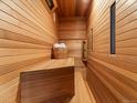 Inviting wooden sauna featuring bench seating and traditional design elements for relaxation at 7858 Oban Ct, Lone Tree, CO 80124