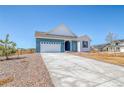 Single-Gathering home featuring an attached two-car garage and an inviting front entrance at 680 Tubman Dr, Elizabeth, CO 80107