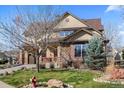 Beautiful two-story home with a well-maintained lawn and a combination of stone and siding exterior at 4236 Frederick Cir, Longmont, CO 80503