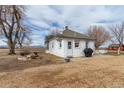 Quaint home with a well-manicured yard, outdoor seating, and a grill, ideal for relaxing and entertaining guests at 14798 N 115Th St, Longmont, CO 80504