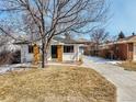 Charming front exterior of home with an inviting entrance and manicured lawn at 3180 S Albion St, Denver, CO 80222