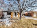 Quaint home featuring a cozy front porch and well-manicured lawn at 3180 S Albion St, Denver, CO 80222