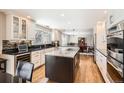 Beautiful kitchen featuring granite countertops, ample cabinet space, and stainless-steel appliances throughout at 3842 S Quebec St, Denver, CO 80237