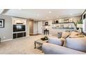 Spacious living area with built-in entertainment center and comfortable seating, perfect for relaxation at 3842 S Quebec St, Denver, CO 80237