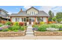 Well-maintained home boasts professionally landscaped front yard and cozy entryway at 2096 S Logan St, Denver, CO 80210