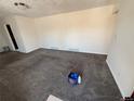 Spacious living room features new carpet, fresh paint, and bright, natural light at 2302 S Raleigh St, Denver, CO 80219