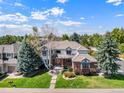 Two-story home with a large backyard and a view of the surrounding neighborhood at 5594 S Jasper Way, Centennial, CO 80015