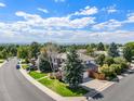 Two-story home with a large backyard and a view of the surrounding neighborhood at 5594 S Jasper Way, Centennial, CO 80015